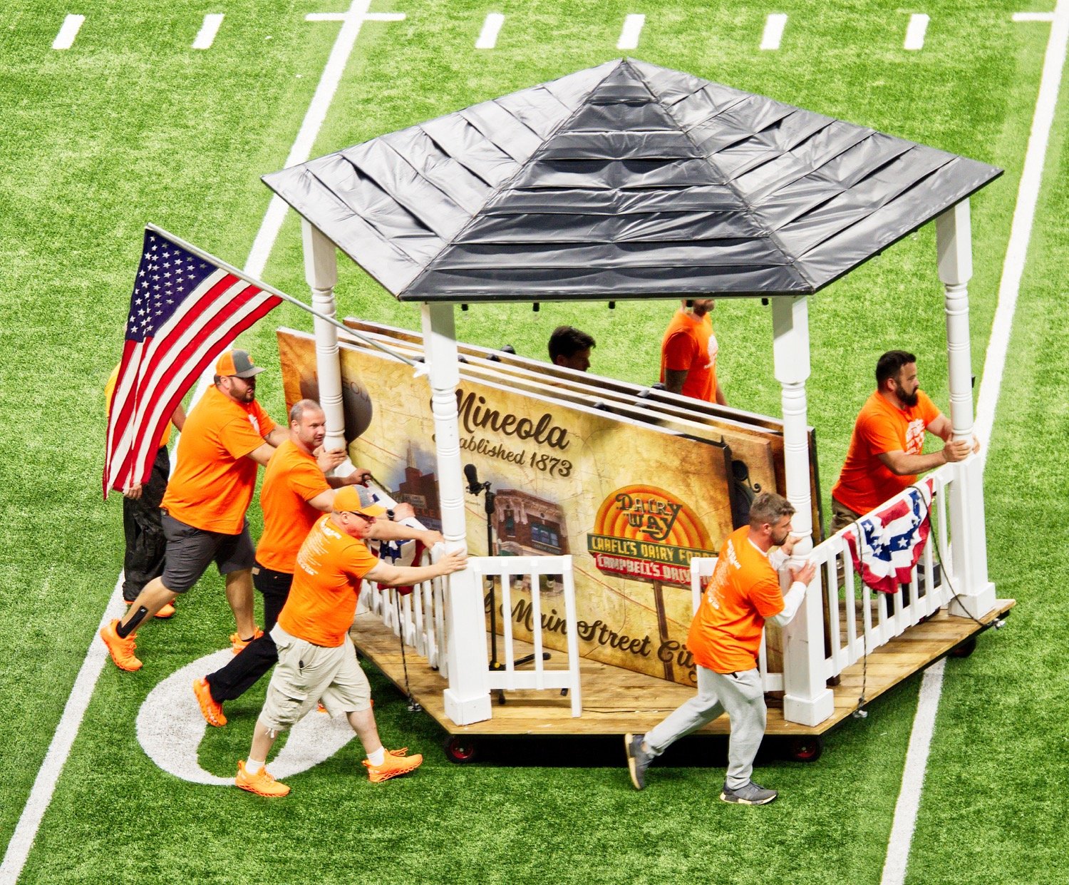 Mineola's band dads roll the replica of the downtown gazebo onto the field prior to the band's finals performance Nov. 3 in the Alamdome.

The band parents have been unbelievable, director Chris Brannan said. “They’ve done everything this year.”

They built all the props for the half-time show, “Hometown,” which was all done from scratch. [See much more of the prelim and finals performances.]